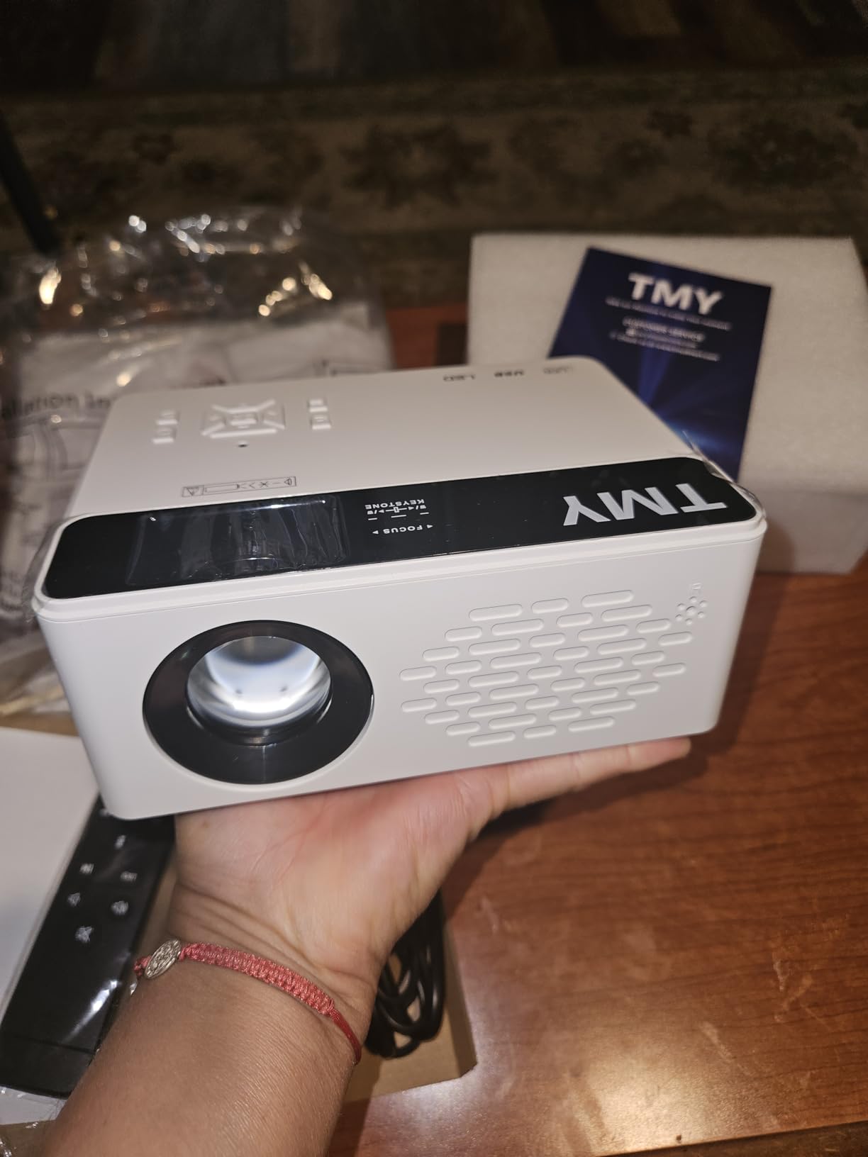 TMY 1080P Full HD Portable Mini Projector, Bluetooth Movie Projector, Compatible with TV Stick/Smartphone/PC/Game Console/HDMI/USB, Indoor & Outdoor Use, with Projector Screen customer photo 2