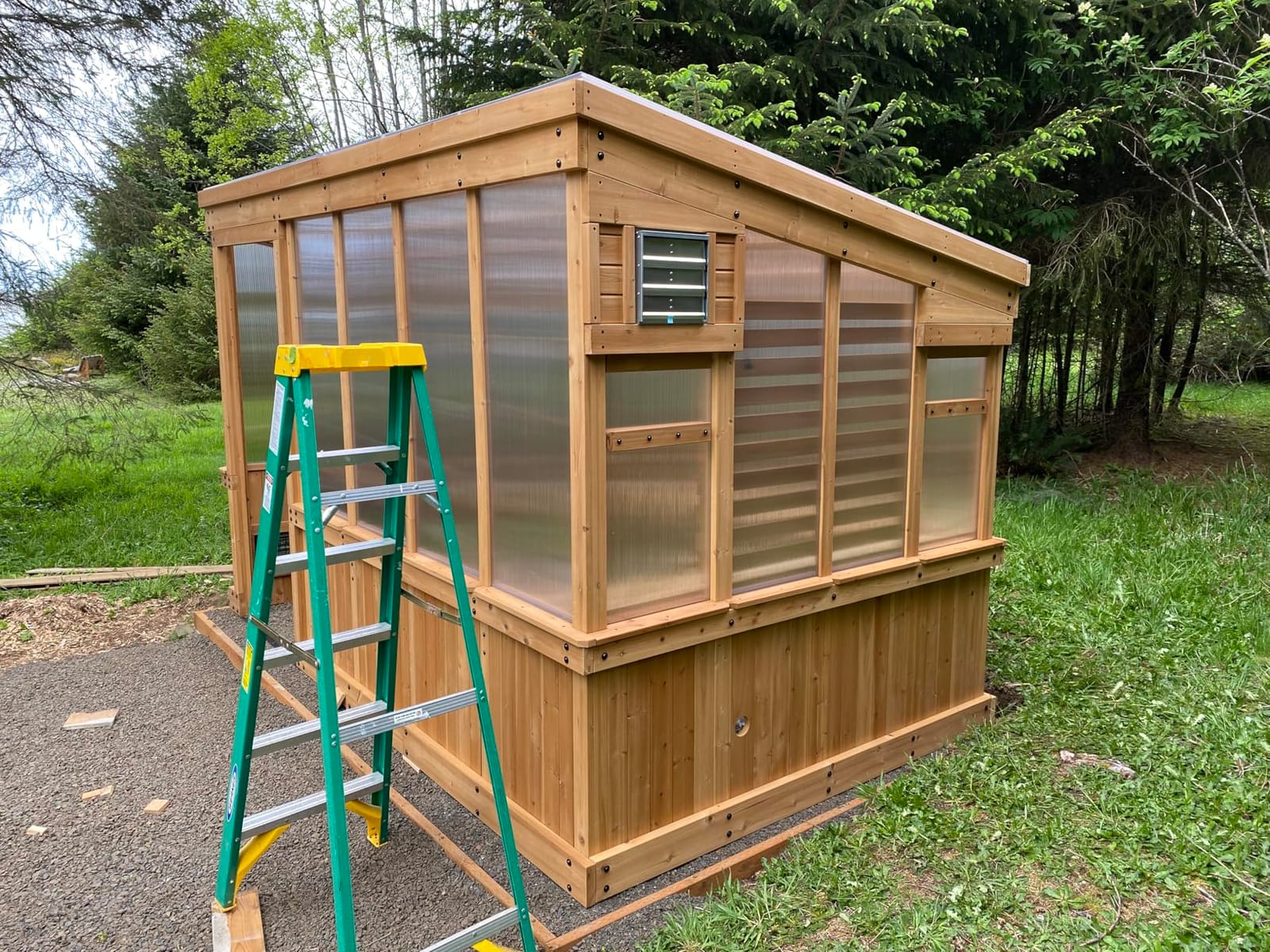 Backyard Discovery Willow 9' x 6' Cedar Wood and Polycarbonate Walk-in Greenhouse Kit with Exhaust Fan, Windows, Hose Hook-Ups, PowerPort, Staging Shelves for Year-Round Outdoor Gardening customer photo 1