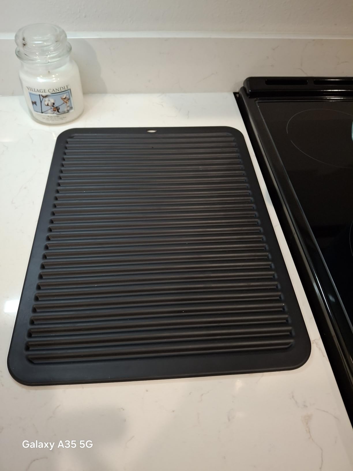 Walfos Silicone Trivet Mats - 4 Heat Resistant Pot Holders, Multipurpose Non-Slip Hot Pads for Kitchen Potholders, Hot Dishers, Jar Opener, Spoon Holder, Food Grade Silicone & BPA Free (Black) customer photo 1